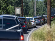 Cars line up trying to get into Frenchman's Bar Regional Park on July 11. As temperatures hit triple digits this week, more people will head to the water to find sport to cool off.
