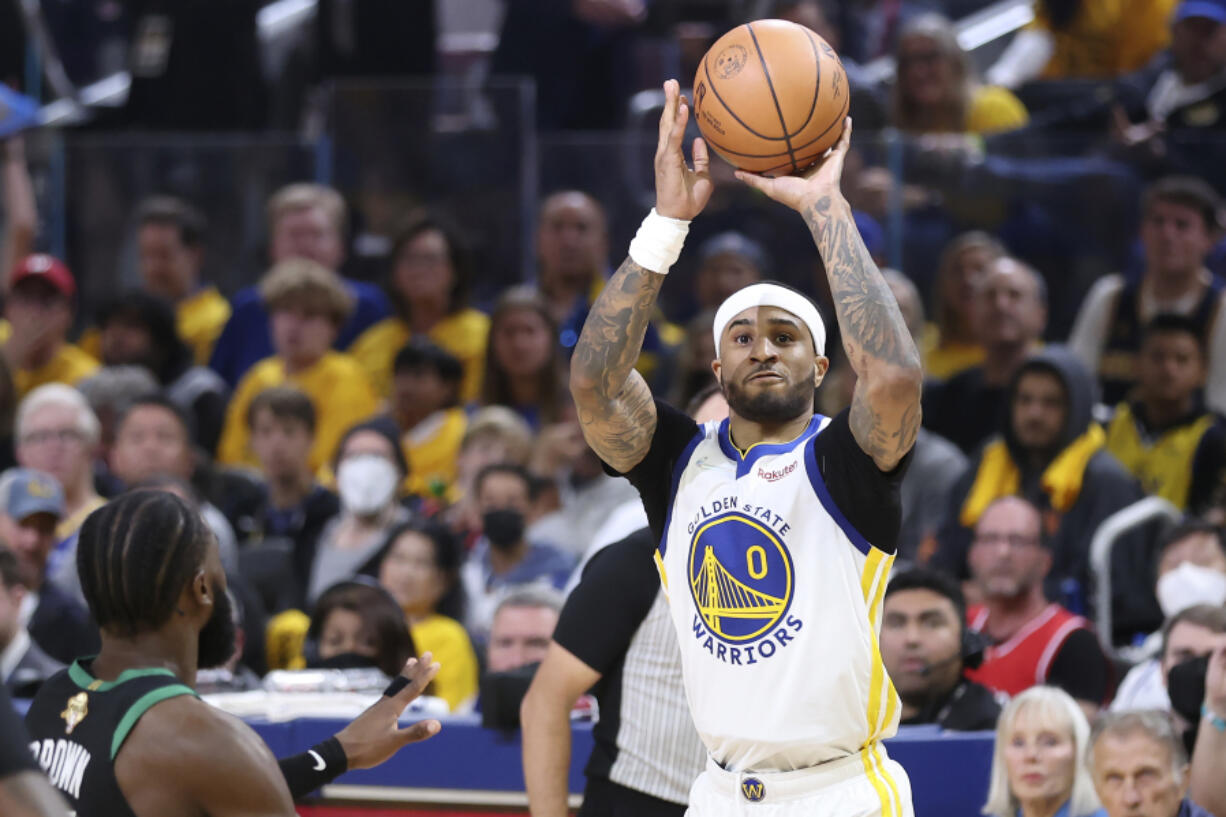 Golden State Warriors guard Gary Payton II (0) shoots against the Boston Celtics during the first half of Game 5 of basketball's NBA Finals in San Francisco, Monday, June 13, 2022.