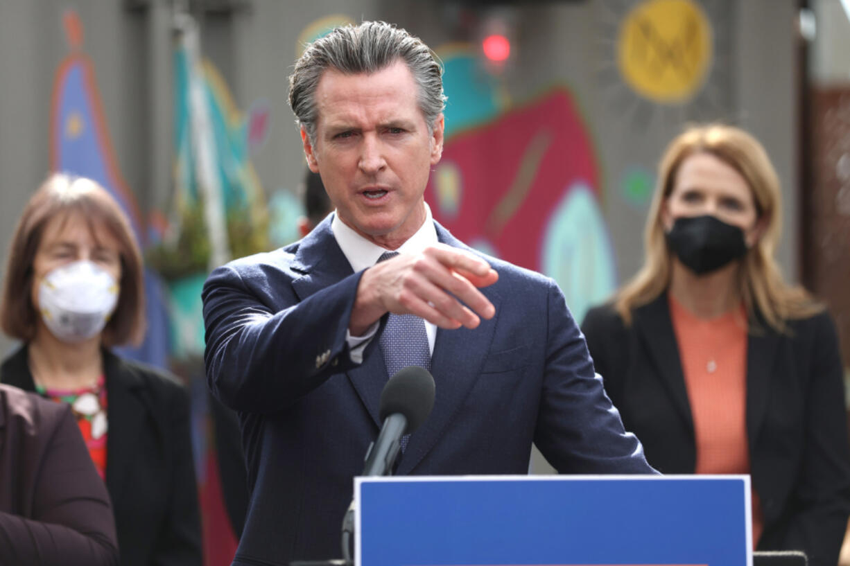California Gov. Gavin Newsom speaks during a bill signing ceremony on Feb. 9, 2022, in San Francisco. California is one of several states that plan to offer cash relief to citizens in response to inflation.