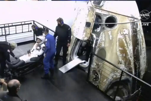 In this image made from video supplied by NASA, astronaut Kayla Barron exits the SpaceX Dragon space capsule after splashing down in the Gulf of Mexico off Tampa, Florida, early Friday, May 6, 2022. NASA???s Barron, Raja Chari, Tom Marshburn and the European Space Agency???s Matthias Maurer undocked from the International Space Station less than 24 hours earlier.