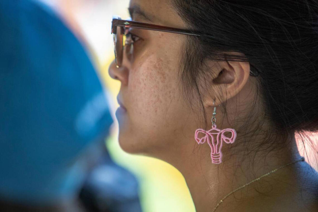 Phoebe Kingsak, 23, listens to speakers at the Bans Off Our Bodies protest outside of the Tarrant County, Texas, Courthouse on June 25.
