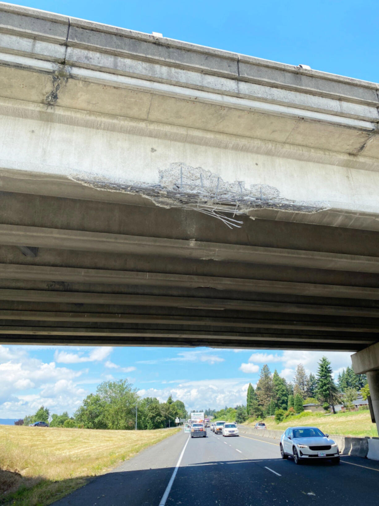 Damage to the Lieser Road overpass on eastbound state Highway 14 after a tractor-trailer struck it Thursday afternoon. Fallen concrete debris damaged five vehicles.