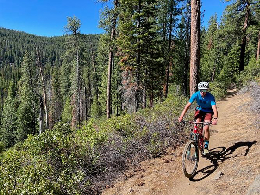 Will Mowry, 15, rides up the Tumalo Ridge Trail west of Bend, Oregon, on June 28, 2022.
