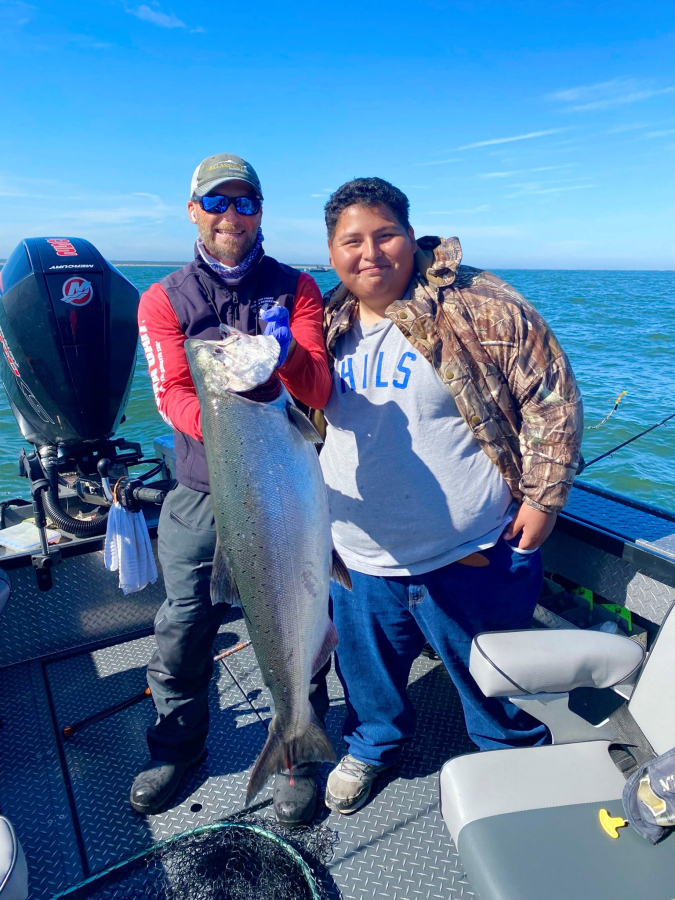 Bill Monroe Jr (left) and a lucky client with a dandy Buoy 10 Upriver Bright fall Chinook. Prospects for this year?s fishery are excellent, although the season is constrained by low numbers of returning lower Columbia wild tule Chinook.