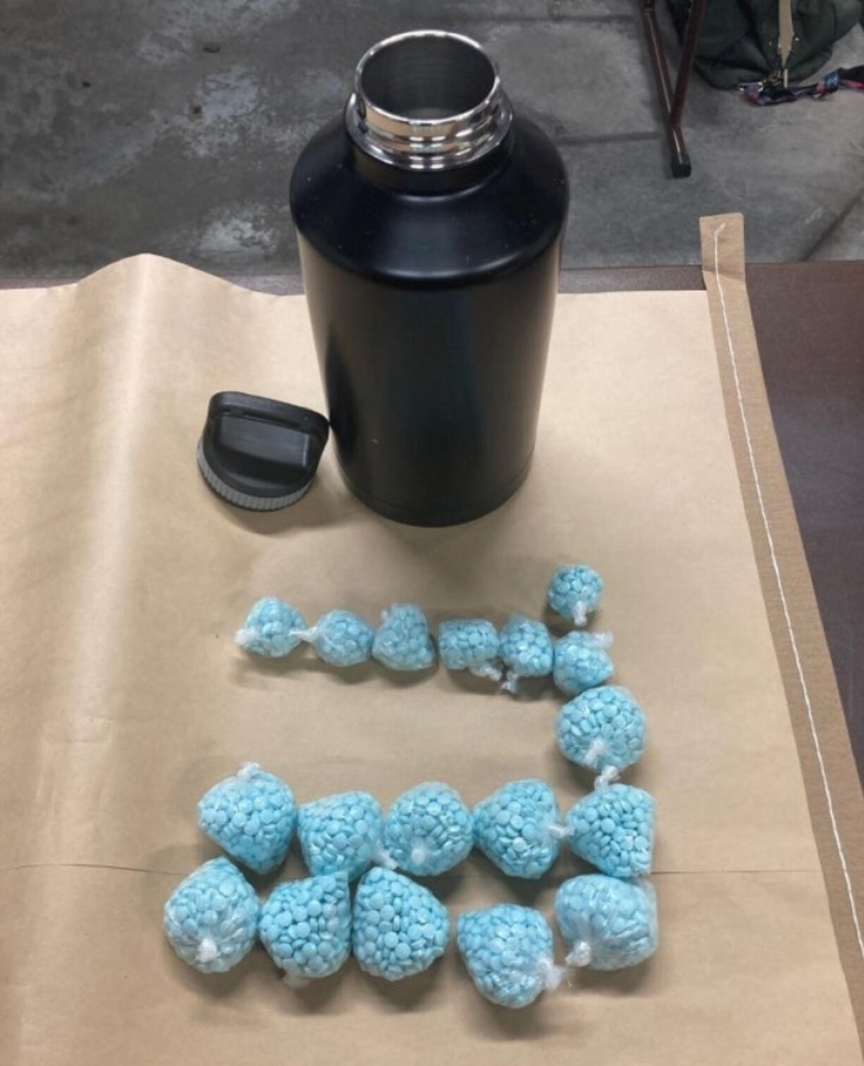 Blue pills police found inside a Vancouver hotel room that they believe to be fentanyl. Police arrested Frank L. Hamil, 37, Friday afternoon on suspicion of possession of a controlled substance with intent to deliver, among other charges.