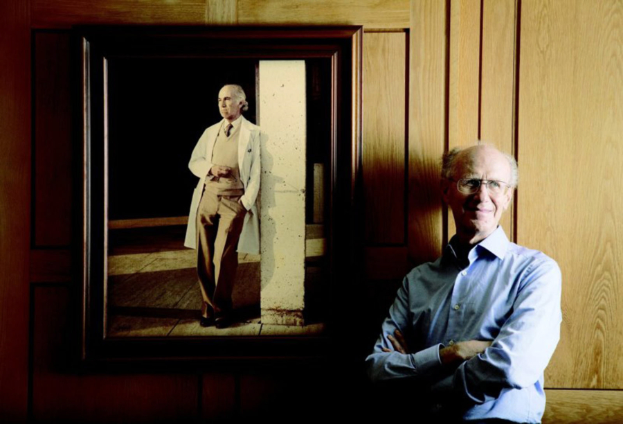 Dr. Peter Salk, one of Dr. Jonas Salk's sons, stands near a photo of his famous father, at the Salk Institute for Biological Studies in La Jolla, California. The elder Salk discovered and developed the first successful inactivated polio vaccine.