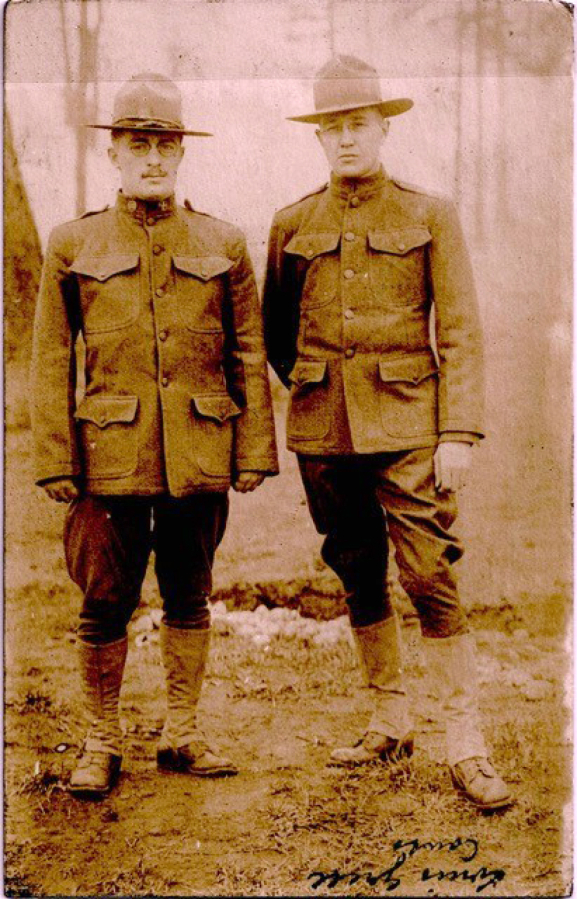 A postcard depicts artist Lewis Grell, right, dressed in a World War I Army uniform and standing with another soldier, likely at the Vancouver Barracks in 1918. Already a well-known artist, Grell (1887-1960) was a soldier of the Spruce Division, but when armistice was declared, production ceased. The postcard's back is a brief note to his sister Helen in Council Bluffs, Iowa.