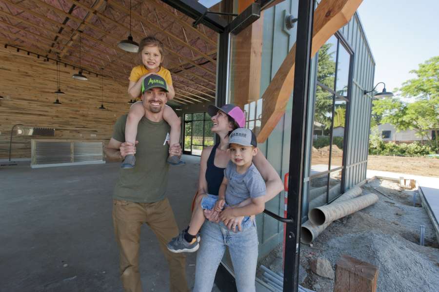 After three years of planning and construction, Ashwood Taps and Trucks is anticipating an early August opening. Owners Tyler and Megan Davis with their children McCall, 4, and Rhettic, 3,   show off the nearly completed project.