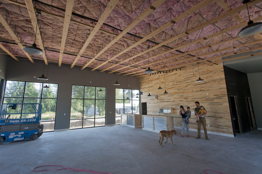 After three years of planning and construction, Ashwood Taps and Trucks is anticipating an early August opening. Owners Tyler and Megan Davis with their children McCall, 4, and Rhettic, 3, and their dog show off the nearly completed project.