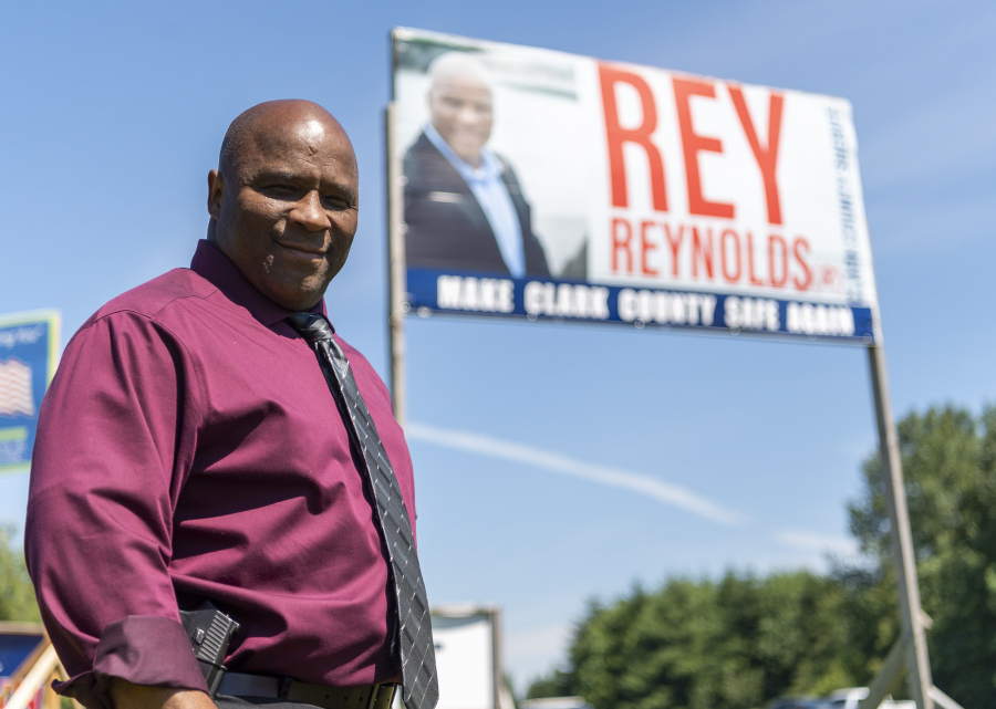 Clark County Sheriff candidate Rey Reynolds stands in front of a campaign sign Wednesday, June 29, 2022, in Walnut Grove.