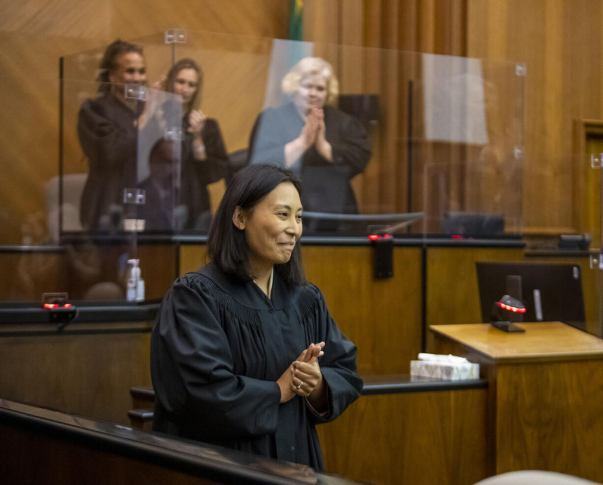 Newly sworn-in Clark County Superior Court Judge Tsering Cornell smiles during applause Friday at the Clark County Courthouse. Cornell is Clark County's first Asian American judge.