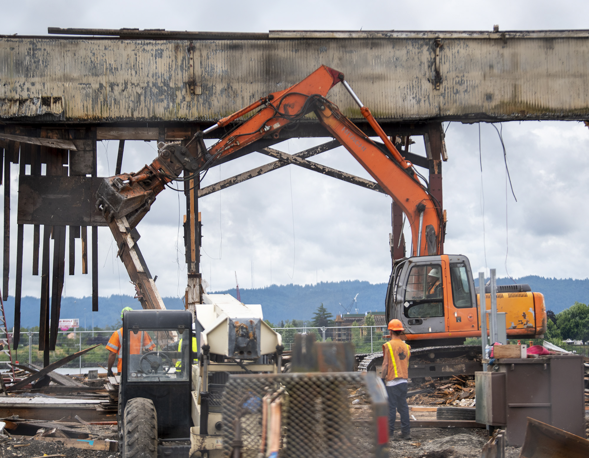 Construction crews continue the demolition of the former Red Lion at the Quay hotel on Wednesday, July 6, 2022 on the Vancouver waterfront.