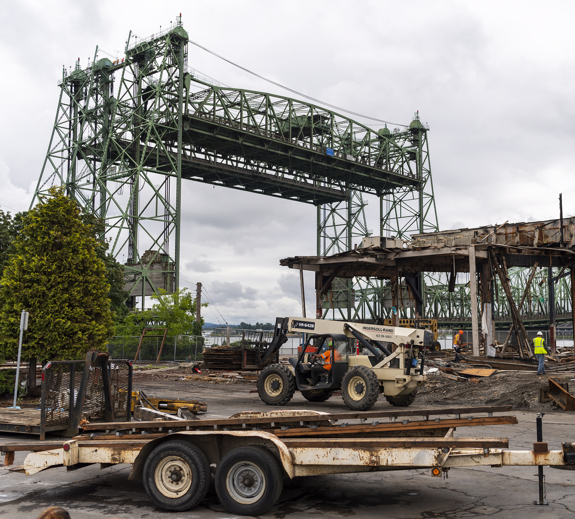 The Interstate 5 Bridge looms over the site of the former Red Lion at the Quay while crews continue demolition on the hotel on Wednesday, July 6, 2022.