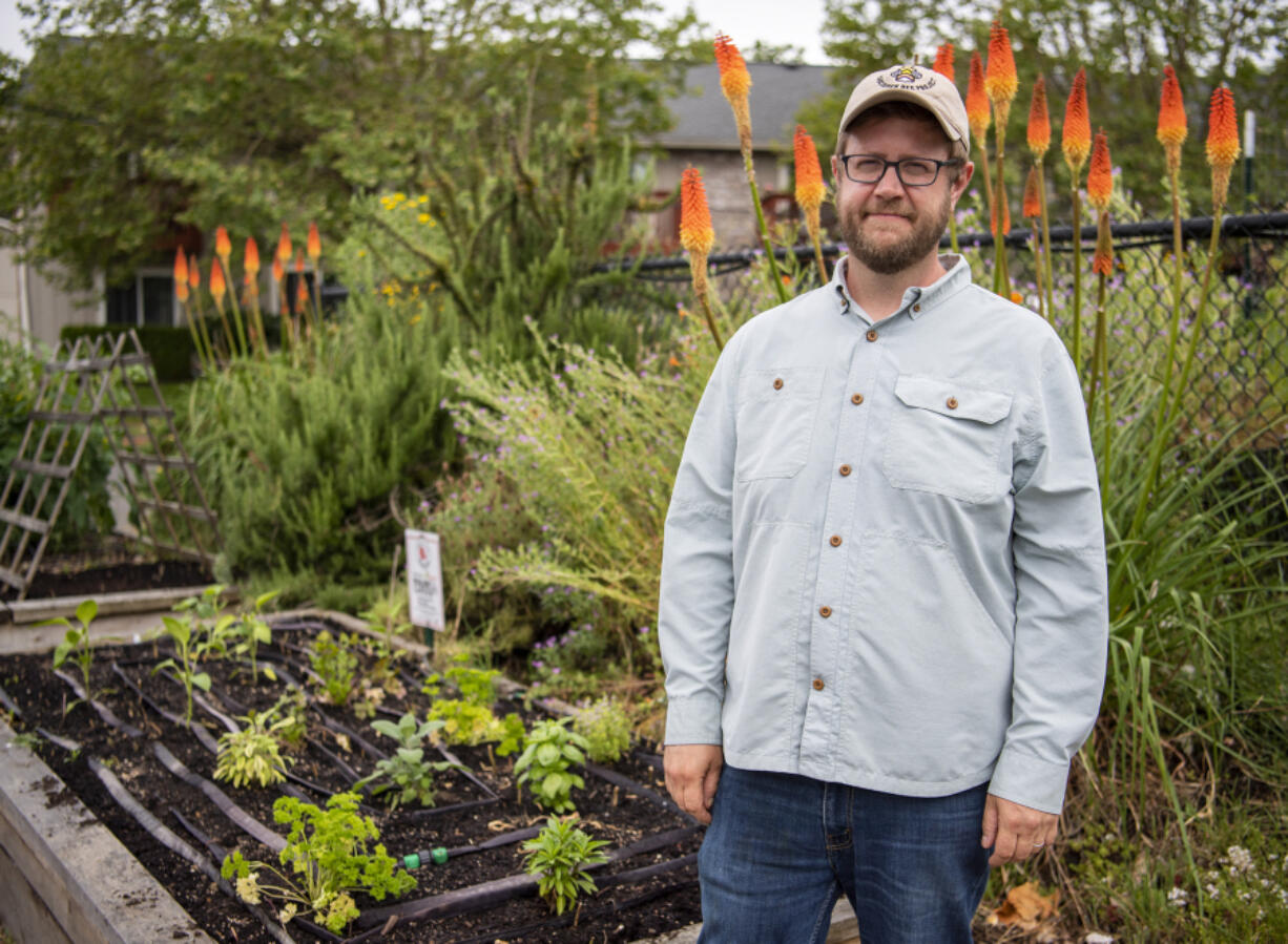Kyle Roslund stands in front of his resiliency garden in central Vancouver. Roslund began his resiliency garden in 2020. Since then, it has helped him connect with his neighbors and reduce food waste. "Later in the summer, this becomes a pretty popular spot," he said.