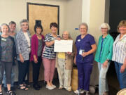 The Clark County Newcomers Club presented a check for $6,279.60 to Lynn Crawford of Hope Dementia on July 5 at their monthly coffee meeting.