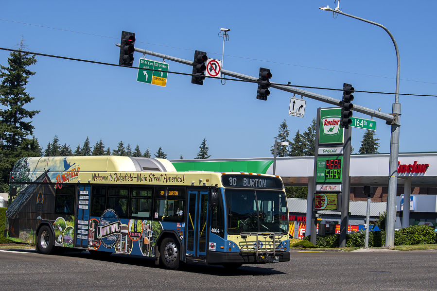 A C-Tran bus passes a Sinclair gas station near Fisher's Landing Transit Center on Tuesday morning.