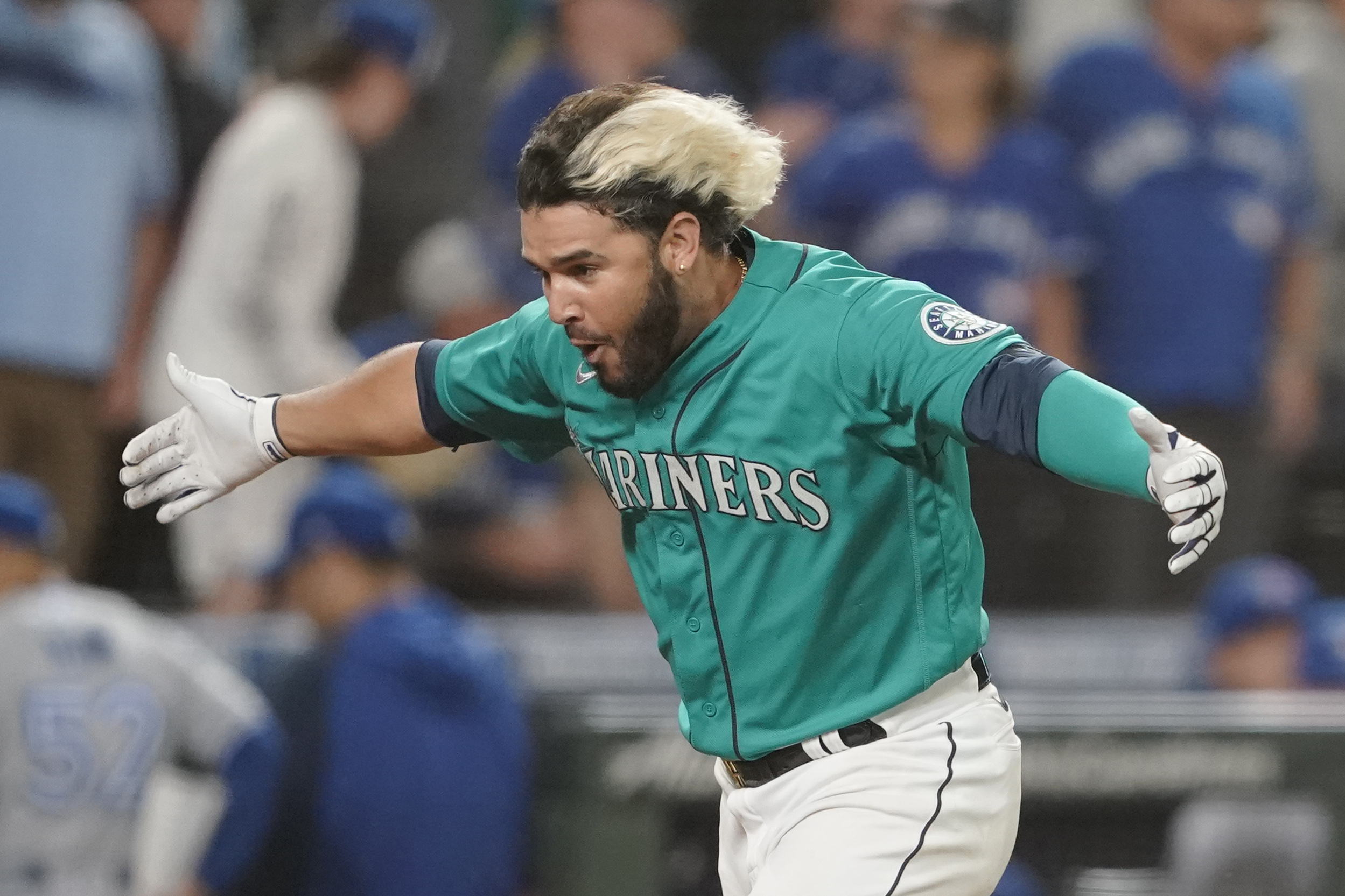 Seattle Mariners' Eugenio Suarez reacts after he hit a walk-off three-run home run against the Toronto Blue Jays during the 11th inning of a baseball game, Friday, July 8, 2022, in Seattle. The Mariners won 5-2 in 11 innings. (AP Photo/Ted S.