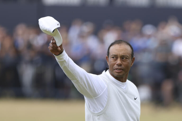 Tiger Woods of the US gestures to the crowd at the end of his second round of the British Open golf championship on the Old Course at St. Andrews, Scotland, Friday July 15, 2022. The Open Championship returns to the home of golf on July 14-17, 2022, to celebrate the 150th edition of the sport's oldest championship, which dates to 1860 and was first played at St. Andrews in 1873.