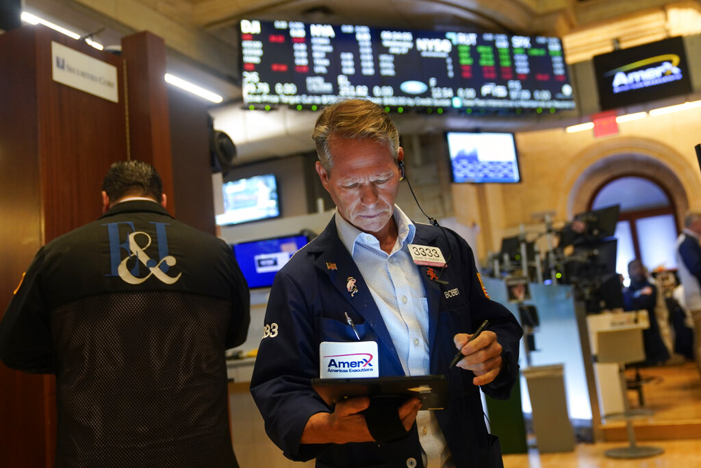 Traders work on the floor at the New York Stock Exchange in New York, Wednesday, July 27, 2022.