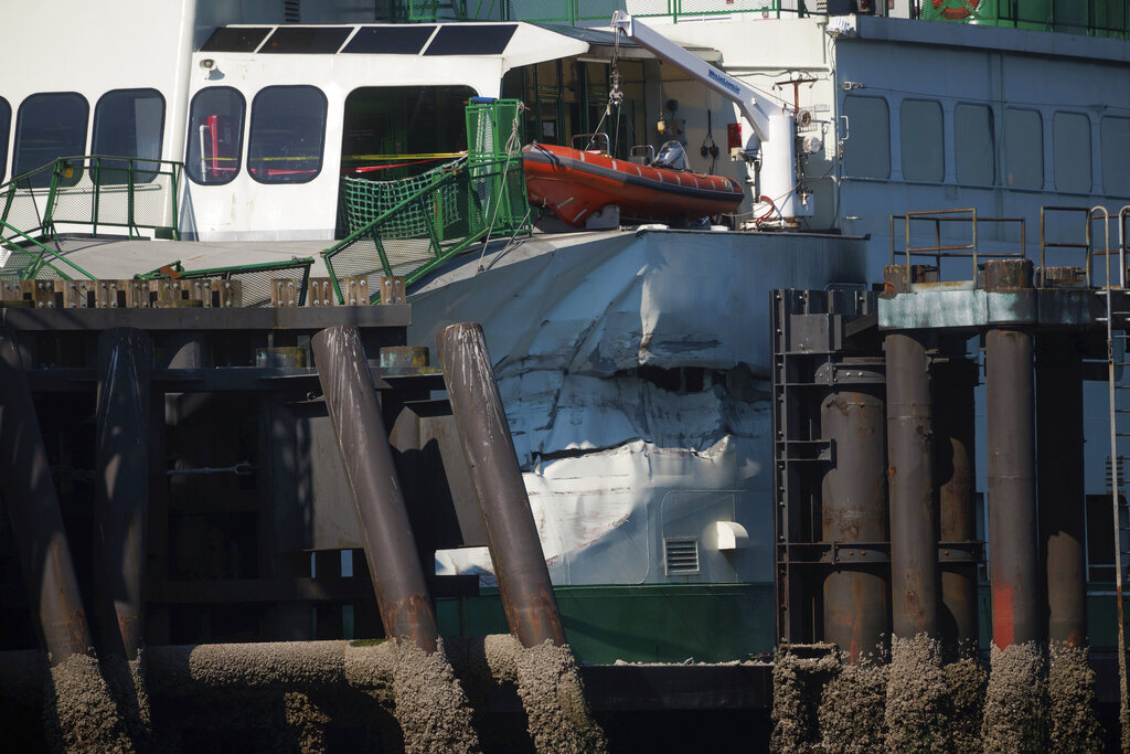 A damaged Cathlamet ferry sits at the Fauntleroy dock in West Seattle, Thursday morning, July 28, 2022. Authorities say an automobile and passenger ferry crashed into a dock Thursday in Seattle, damaging the vessel.