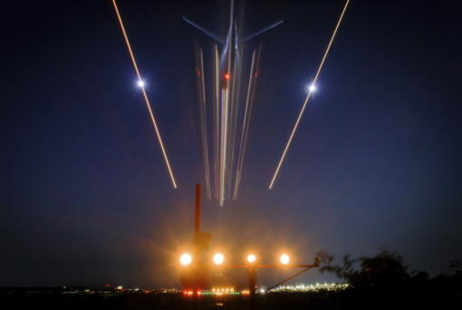A passenger jet streaks toward a landing at Reagan National Airport in Arlington, Va, Thursday evening, June 30, 2022. Heavy travel is expected over the Fourth of July holiday in the United States. (AP Photo/J.