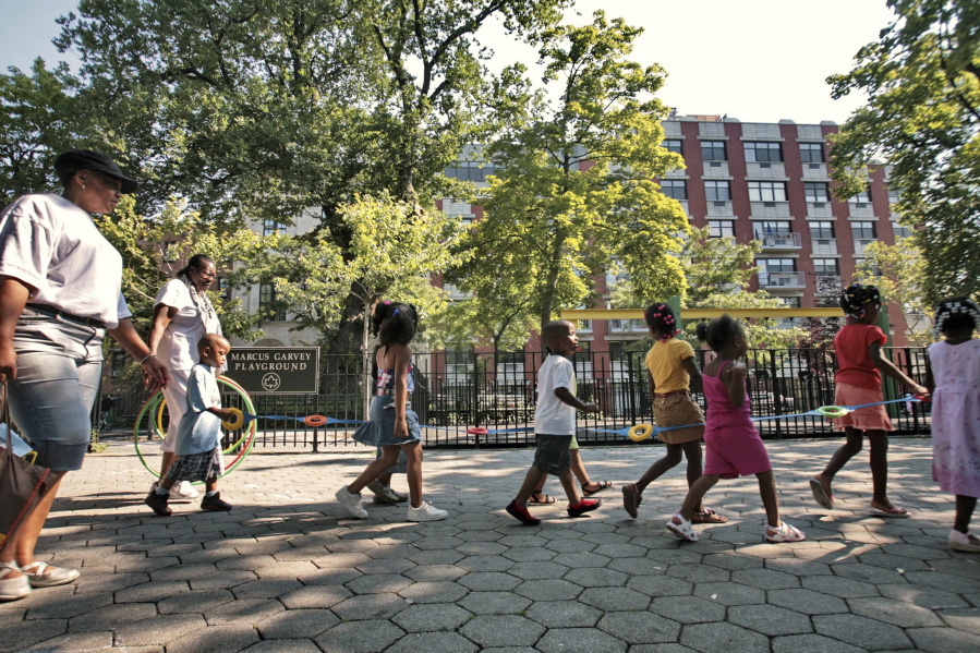 FILE - Children from a nearby daycare are escorted in Marcus Garvey Park in the Harlem neighborhood of New York Wednesday, Aug. 1, 2007. Some states have moved ahead with plans of their own to boost child care subsidies after a national effort by Democrats in Washington stalled. New York lawmakers passed a state budget in the spring that calls for it to spend $7 billion making child care more affordable over the next four years.