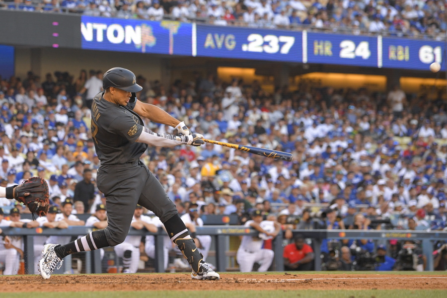 American League's Giancarlo Stanton, of the New York Yankees, swings at a pitch while hitting a two-run home run off National League pitcher Tony Gonsolin, of the Los Angeles Dodgers, during the fourth inning of the MLB All-Star baseball game, Tuesday, July 19, 2022, in Los Angeles. (AP Photo/Mark J.