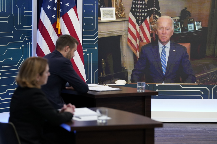 President Joe Biden listens as he attends virtually an event in the South Court Auditorium on the White House complex in Washington, Monday, July 25, 2022. Biden, who continues to recover from his coronavirus infection, spoke virtually with business executives and labor leaders to discuss the Chips Act, a proposal to bolster domestic manufacturing.