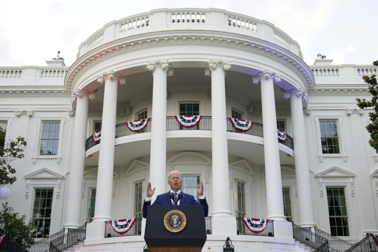 FILE - President Joe Biden speaks during an Independence Day celebration on the South Lawn of the White House, July 4, 2021, in Washington. Last Fourth of July, Biden gathered hundreds of people outside the White House for an event that would have been unthinkable for many Americans the previous year. With the coronavirus in retreat, they ate hamburgers and watched fireworks over the National Mall.