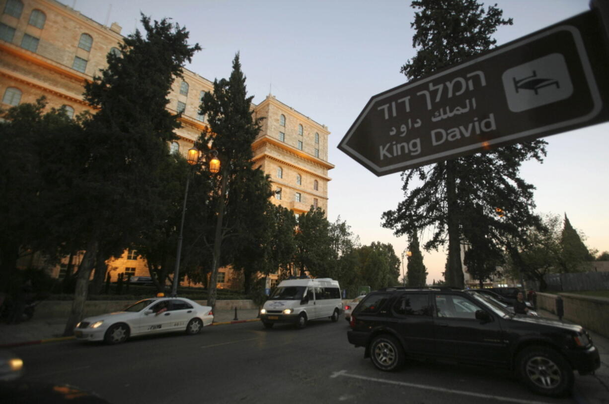 FILE - The exterior of the King David Hotel is seen from King David street in Jerusalem, Dec. 11, 2007. U.S. President Joe Biden's dash through the Israel and the occupied West Bank this week is expected to cut across some of the region's most iconic places. Both luxurious and grueling, Biden's visit starts with a VIP arrival at Israel's main commercial airport and pings through Jerusalem and the occupied West Bank. Most of his travels are focused on business, but in between his meetings with Israeli and Palestinian leaders, he will visit a host of well-known sites while staying at a historic Jerusalem hotel.