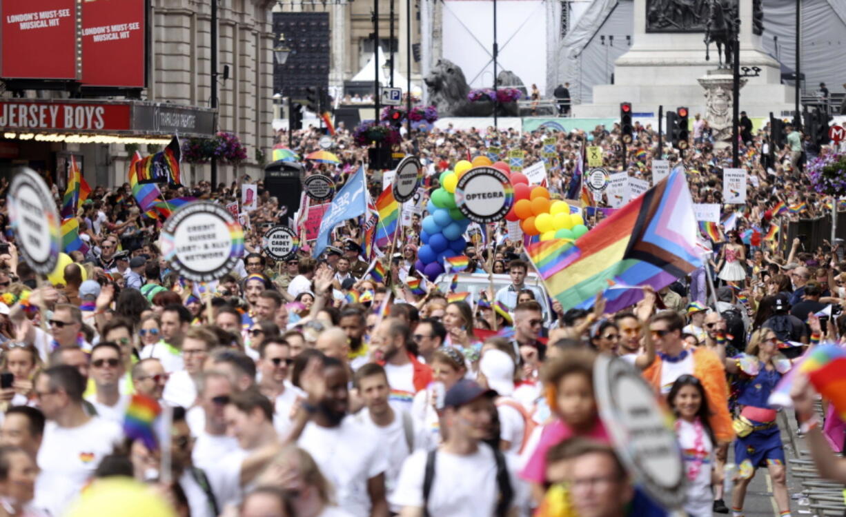 People take part in the Pride rally in London, Saturday July 2, 2022. The U.K. capital marked 50 years of Pride as a vibrant crowd of hundreds of thousands turned out to either take part in or watch the festivities, forming a spectacle of rainbow flags, glitter and sequins. After two years of cancellations because of the coronavirus pandemic, the parade came a half-century after London's first march to celebrate Pride in 1972.