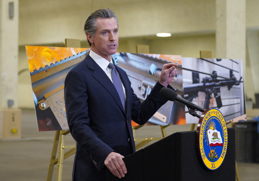 FILE - California Gov. Gavin Newsom speaks to reporters at Del Mar Fairgrounds on Feb. 18, 2022, in Del Mar, Calif. Newsom announced Friday, July 22, he will sign a controversial, first-in-the-nation gun control law patterned after a Texas anti-abortion law. (Nelvin C.