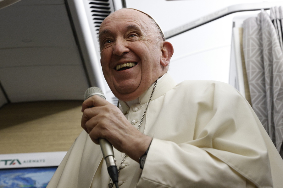 Pope Francis speaks to journalists aboard the papal flight back from Canada Saturday, July 30, 2022, where he paid a six-day pastoral visit.