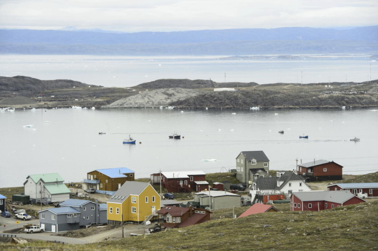 FILE - Small boats make their way through the Frobisher Bay inlet in Iqaluit, Nunavut, Canada on Friday, Aug. 2, 2019.  In his extensive papal travels, Pope Francis has never journeyed further north than Iqaluit, the capital city of the Inuit-governed territory of Nunavut in northern Canada.