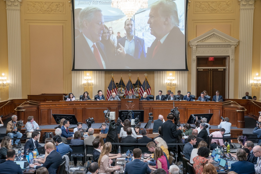 A image of former President Donald Trump talking to his Chief of Staff Mark Meadows is seen as Cassidy Hutchinson, former aide to Trump White House chief of staff Mark Meadows, testifies as the House select committee investigating the Jan. 6 attack on the U.S. Capitol holds a hearing at the Capitol in Washington, Tuesday, June 28, 2022.