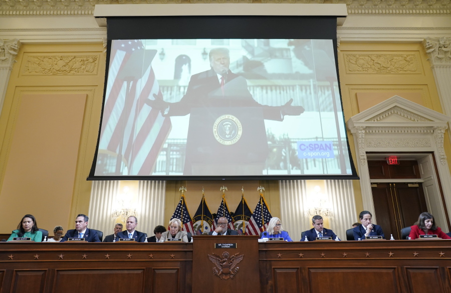 FILE - A video of former President Donald Trump speaking during a rally near the White House on Jan. 6, 2021, is shown as committee members from left to right, Rep. Stephanie Murphy, D-Fla., Rep. Pete Aguilar, D-Calif., Rep. Adam Schiff, D-Calif., Rep. Zoe Lofgren, D-Calif., Chairman Bennie Thompson, D-Miss., Vice Chair Liz Cheney, R-Wyo., Rep. Adam Kinzinger, R-Ill., Rep. Jamie Raskin, D-Md., and Rep. Elaine Luria, D-Va., look on, during a public hearing of the House select committee investigating the attack on Capitol Hill, Thursday, June 9, 2022, in Washington.
