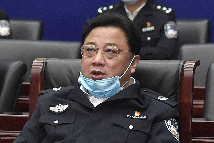 FILE - Sun Lijun, then a vice minister of public security, attends a meeting in Wuhan in central China's Hubei Province on April 7, 2020. A former Chinese vice minister of public security went on trial Friday, July 8, 2022, accused of collecting 646 million yuan ($96.3 million) in bribes over nearly two decades.