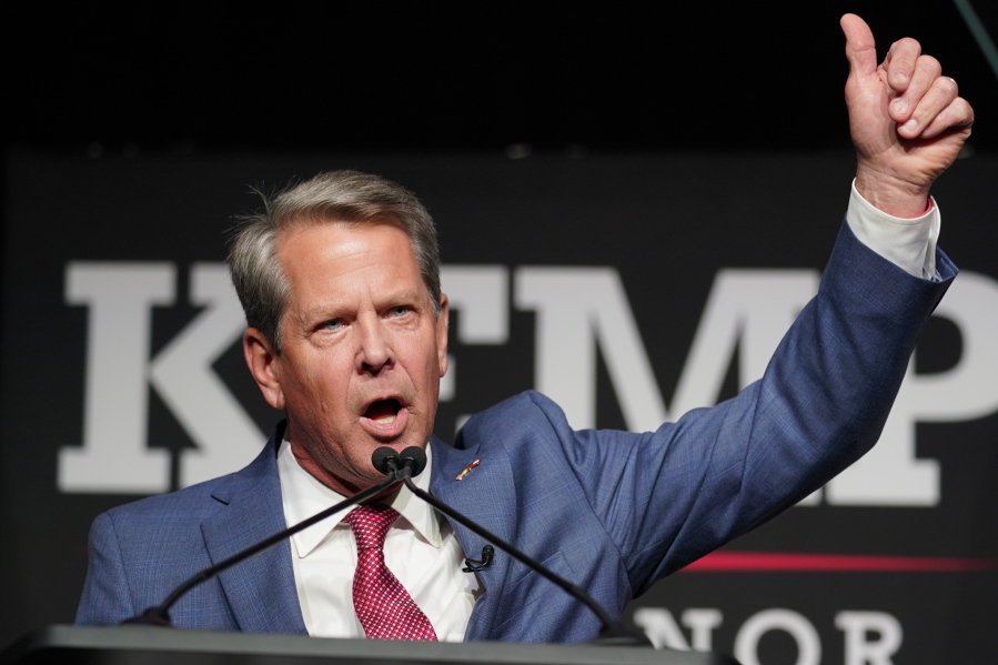 FILE - Republican Gov. Brian Kemp waves to supporters during an election night watch party, May 24, 2022, in Atlanta. Kemp easily turned back a GOP primary challenge Tuesday from former Sen. David Perdue, who was backed by former President Donald Trump.