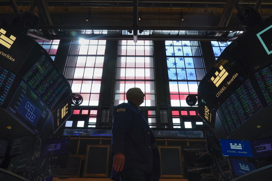 Traders work on the floor at the New York Stock Exchange in New York, Friday, July 1, 2022. Stocks wavered between small gains and losses in morning trading on Wall Street Wednesday, July 6 as worries about inflation, rising interest rates and a potential recession weigh on the broader market.