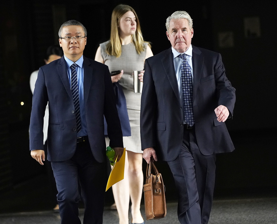 Former Minneapolis police officer Tou Thao, left, and his attorney Robert Paule arrive for sentencing for violating George Floyd's civil rights outside the Federal Courthouse Wednesday, July 27, 2022 in St. Paul, Minn.  The last two former Minneapolis police officers who were convicted of violating George Floyd's civil rights have been sentenced in federal court. J. Alexander Kueng was sentenced Wednesday to three years and Thao got a 3 1/2-year sentence. They were convicted in February of two counts of violating Floyd's civil rights.