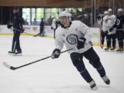 Seattle Kraken's Shane Wright (51) skates during a drill at the NHL hockey team's first Prospect Development Camp, Monday, July 11, 2022, in Seattle. For several years, Shane Wright was predetermined to be the No. 1 pick in the NHL draft. When the draft finally arrived, Wright tumbled right into the waiting arms of the Seattle Kraken, a team in need of a boost heading into its second season.