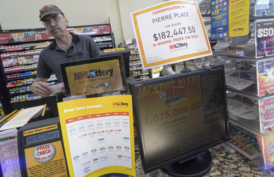 Bruce Gideos, manager at Pierre's Place, in Chesterfield, N.H., prints out Mega Millions tickets on Wednesday, July 27, 2022. The Mega Millions jackpot has topped $1 billion before Friday's drawing.