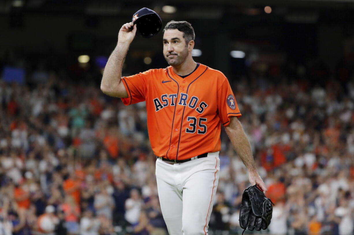 Houston Astros starting pitcher Justin Verlander (35) tips his cap to the crowd after being removed during the eighth inning of the team's baseball game against the Seattle Mariners on Friday, July 29, 2022, in Houston.