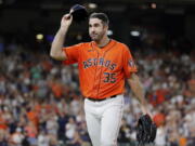 Houston Astros starting pitcher Justin Verlander (35) tips his cap to the crowd after being removed during the eighth inning of the team's baseball game against the Seattle Mariners on Friday, July 29, 2022, in Houston.