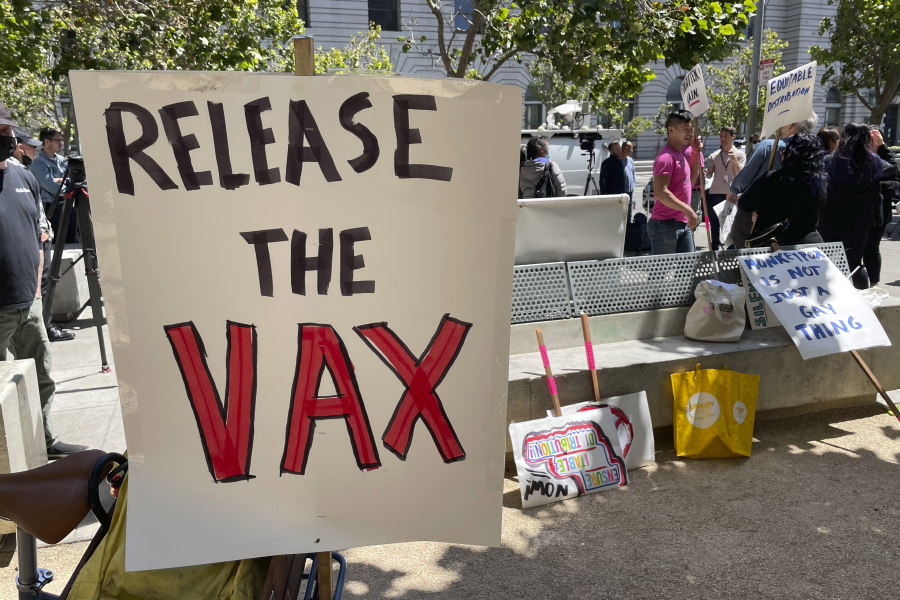 FILE - A sign urges the release of the monkeypox vaccine during a protest in San Francisco, July 18, 2022. The mayor of San Francisco announced a legal state of emergency Thursday, July 28, 2022, over the growing number of monkeypox cases. Public health officials warn that moves by rich countries to buy large quantities of monkeypox vaccine, while declining to share doses with Africa, could leave millions of people unprotected against a more dangerous version of the disease and risk continued spillovers of the virus into humans.
