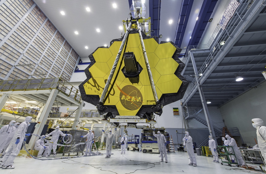 FILE - In this April 13, 2017, photo provided by NASA, technicians lift the mirror of the James Webb Space Telescope using a crane at the Goddard Space Flight Center in Greenbelt, Md. NASA is releasing the first images from the new telescope this week.