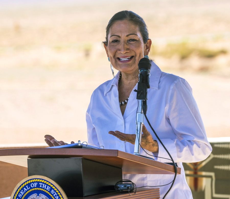 FILE - U.S. Secretary of the Interior Deb Haaland speaks after signing the agreement for the Navajo federal reserved water rights settlement at Monument Valley, Utah on Friday, May 27, 2022. Haaland will visit Oklahoma on Saturday, July 9, 2022, as part of a year-long tour across the country to provide Native survivors of the federal boarding school system and their descendants an opportunity to share their experiences. Haaland will meet with survivors and their descendants at the Riverside Indian School in Anadarko, Okla.