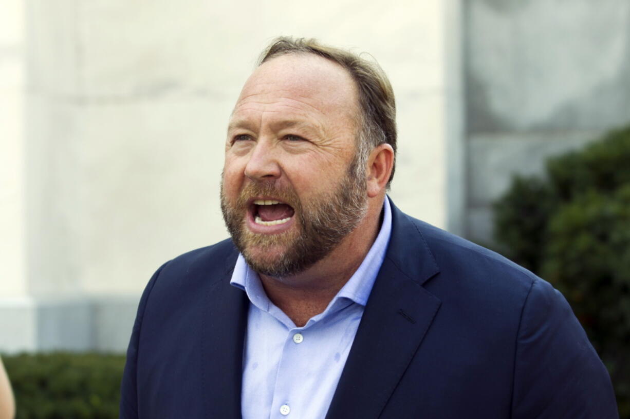 FILE - Infowars host and conspiracy theorist Alex Jones speaks outside of the Dirksen building on Capitol Hill in Washington, Sept. 5, 2018. Jury selection is set for Monday, July 25, 2022, in a trial that will determine for the first time how much Jones must pay Sandy Hook Elementary School parents for falsely telling his audience that the deadliest classroom shooting in U.S. history was a hoax.