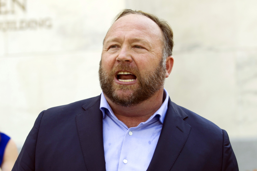 FILE - Infowars host Alex Jones speaks outside of the Dirksen building on Capitol Hill, Sept. 5, 2018, in Washington. Jones was defiant and cited free speech rights during a deposition in April, as part of a lawsuit by relatives of some of the Sandy Hook Elementary School shooting victims who are suing him for calling the massacre a hoax, according to court documents released Thursday, July 14, 2022.