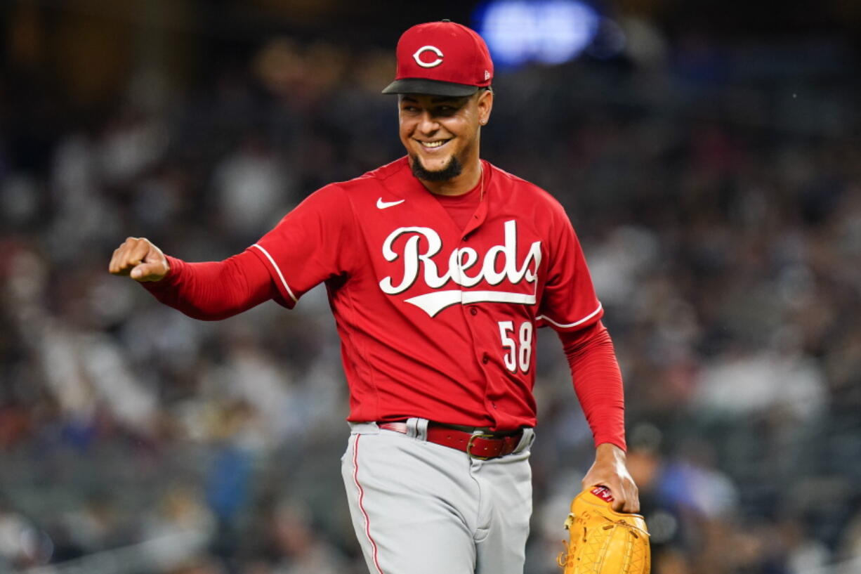 Cincinnati Reds starting pitcher Luis Castillo gestures to a teammate at the end of the sixth inning of the team's baseball game against the New York Yankees on Thursday, July 14, 2022, in New York.